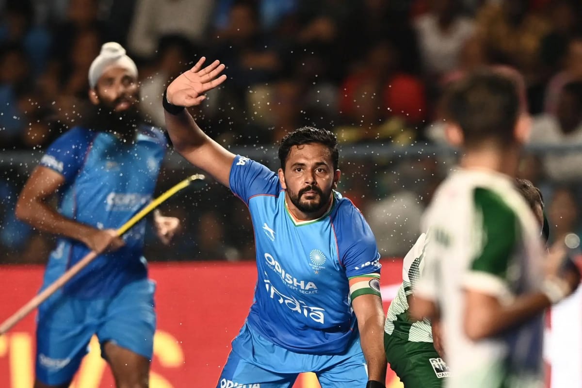 Harmanpreet Singh and Indian hockey players celebrate during the India-Pakistan Hockey World Cup match in Amstelveen.