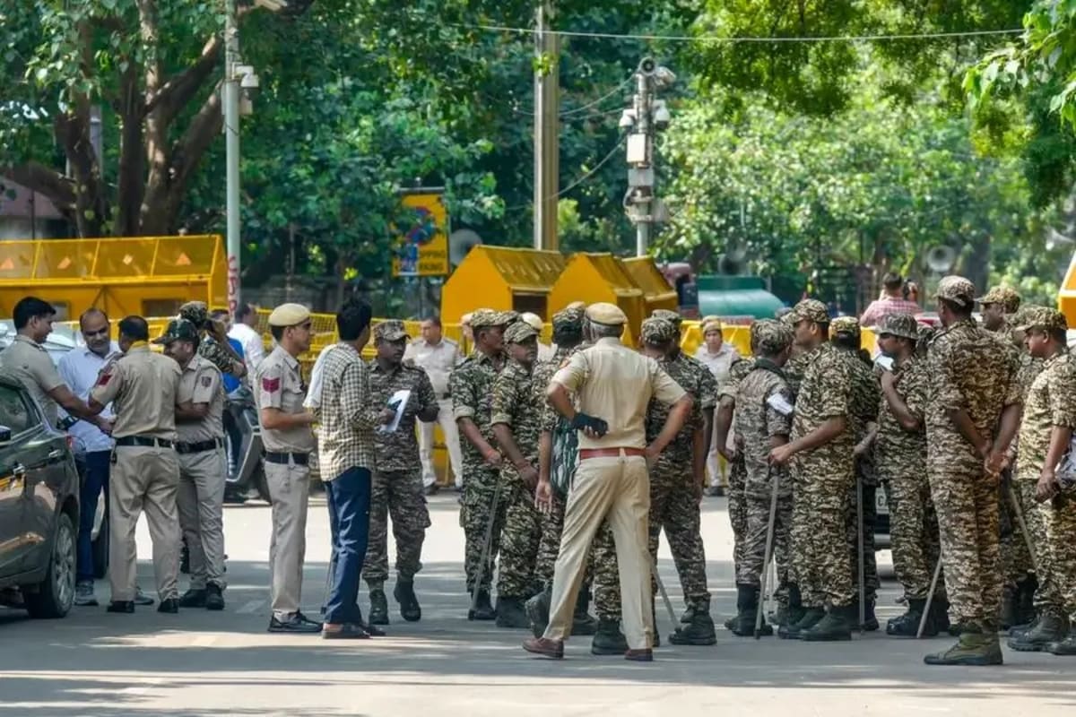 Delhi Police personnel and barricades deployed near Jantar Mantar in New Delhi.