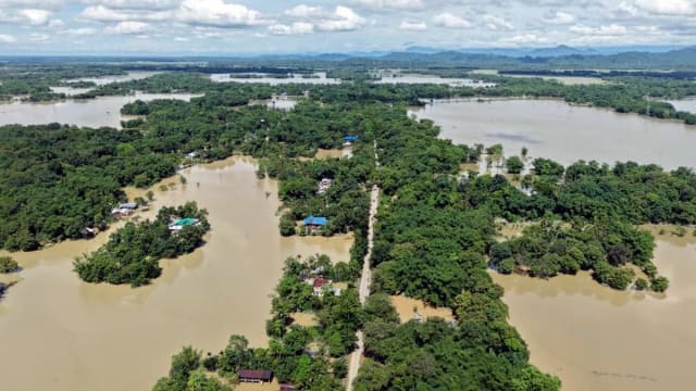 Floodwaters inundate villages in Assam as rising river levels affect thousands of people.
