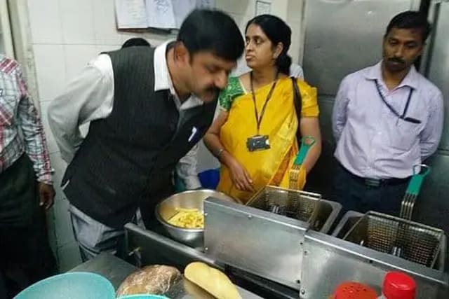 Food safety officials inspecting food storage facilities at a Bengaluru luxury hotel during a Karnataka FDA inspection drive.