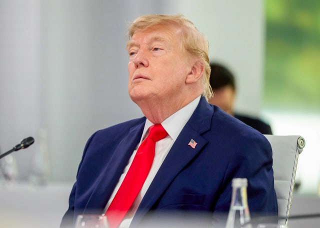 US President Donald Trump signs a proclamation imposing tariffs on sensitive foreign drone imports