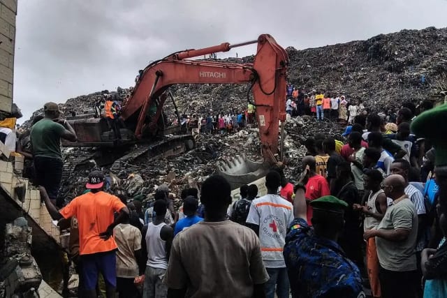Rescue workers search debris after landfill landslide in Conakry Guinea.