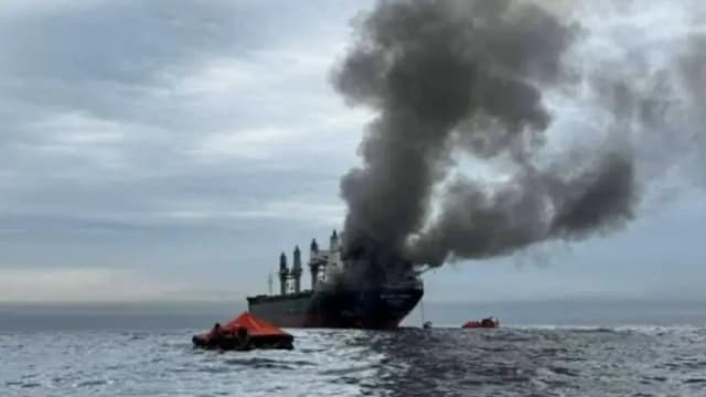 Commercial vessels near the Strait of Hormuz amid heightened shipping security concerns.