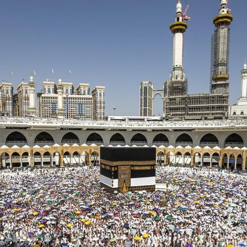 The Kaaba at night surrounded by pilgrims