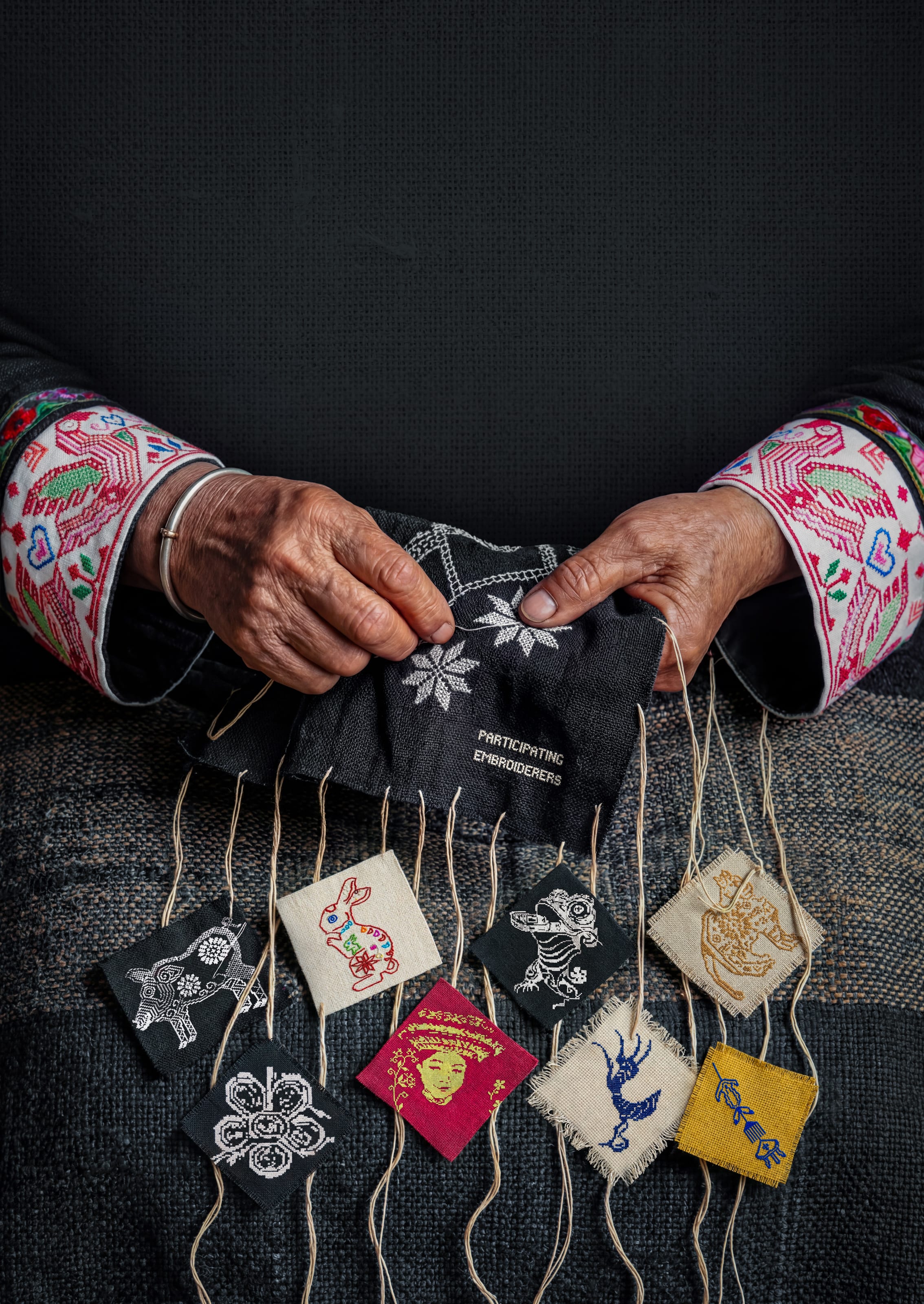 A close-up photograph of traditional Huayao embroidery...