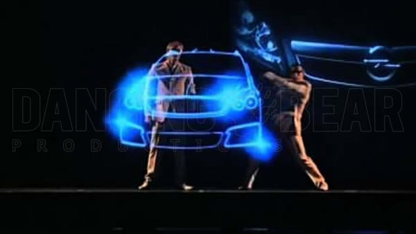 Holographic Performance Two Dancers with blue holographic Car