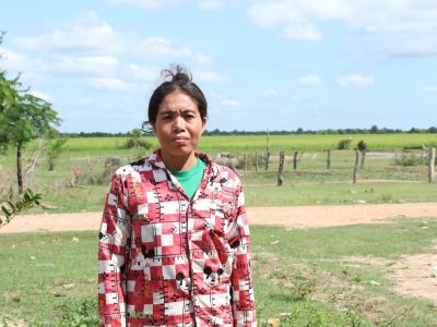 Mrs. Vanny looks forward to harvesting her rice soon. 