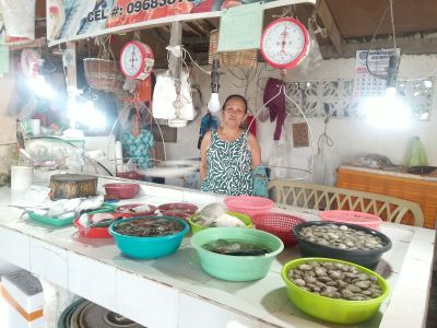 Thanks to her loan and hard work, Virginia’s fish vending business is thriving.