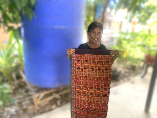 Kanlaya has increased her income through silk production, enabling her to better support her family