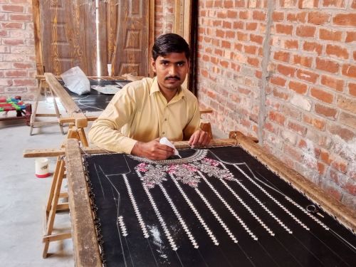 Shabeer Hussain flourished in his embroidery work and improved his wellbeing