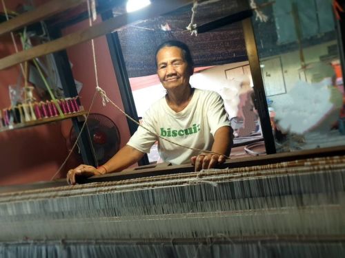 Mali invested in a new loom to increase her silk weaving production.