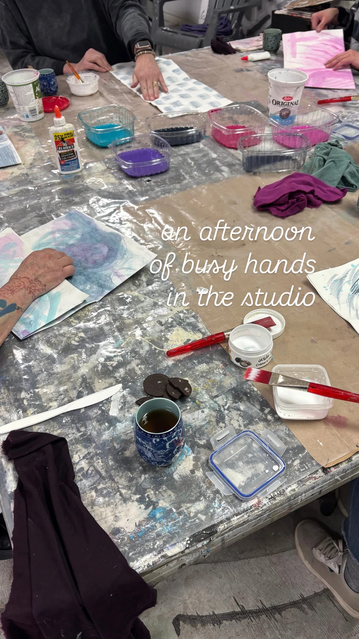 4-6 of your friends or employees around a table creating