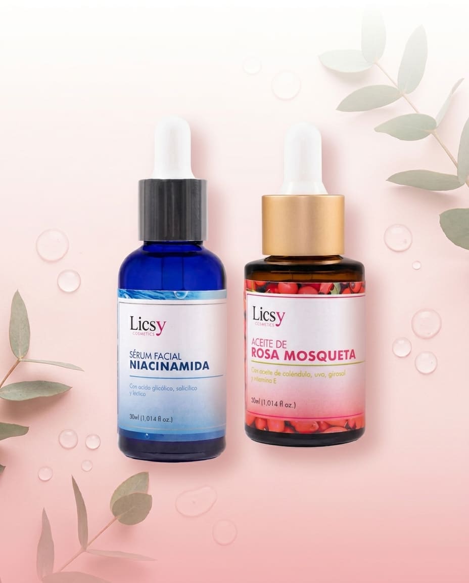 Sérum facial de niacinamida y aceite de rosa mosqueta Licsy Cosmetics, sobre fondo rosa con hojas de eucalipto.