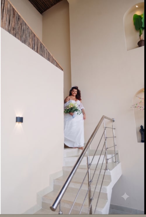 The bride on the villa staircase - real wedding held at Villa Lotus Tolú, Colombia