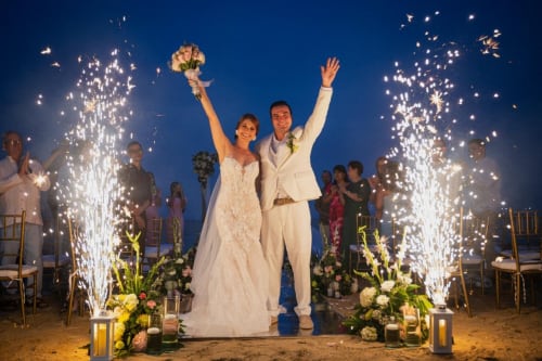 Send-off with cold sparklers by the sea - real wedding held at Villa Lotus Tolú, Colombia