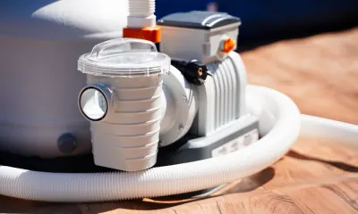 Professional pool equipment installation showing modern pool pump and filtration system