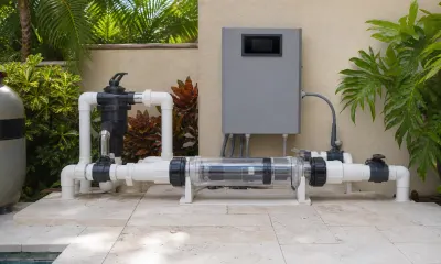 Salt chlorine generator cell mounted on a residential pool equipment pad in South Florida