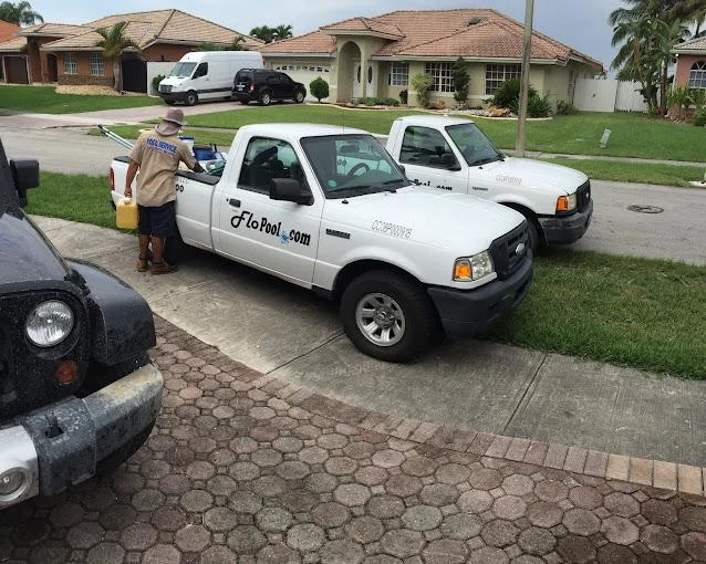 FloPool branded service trucks staged for South Miami routes