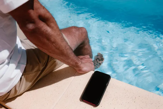 Phone by swimming pool