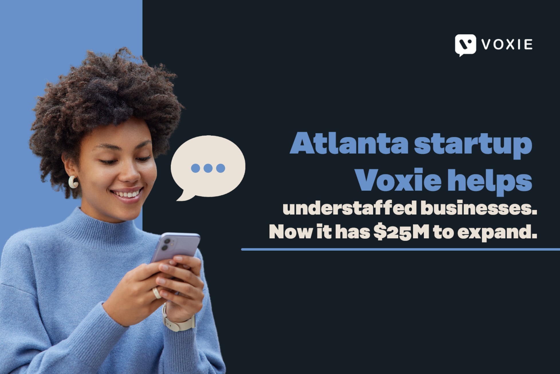 Woman smiling while reading a message on her phone. 