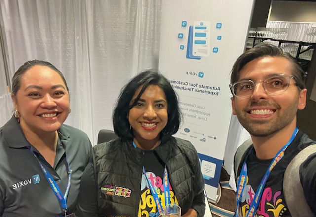Marketing rock stars, Sharla Sookdeo, Assistant VP of Marketing and Christian Manzano, Marketing Director at TLE stop to pose with Melissa during the welcoming ceremonies
