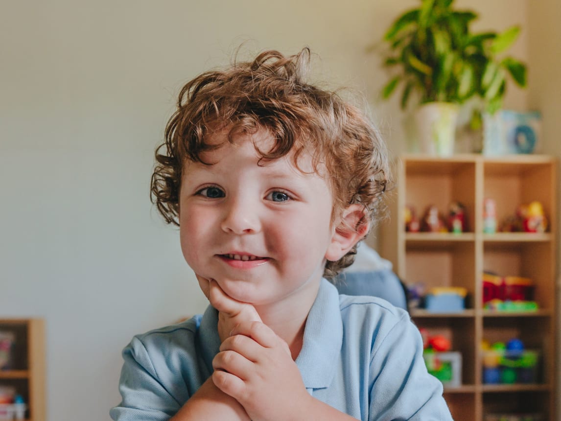 Kid sitting at table at school