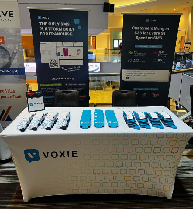 Voxie’s sponsorship booth at QSR Evolution. If you look closely, you’ll see the best socks at the event.