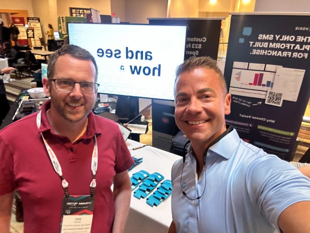Eric Bates, Head of Digital at Krispy Kreme, taking a selfie with Voxie CEO, Adam Waid.