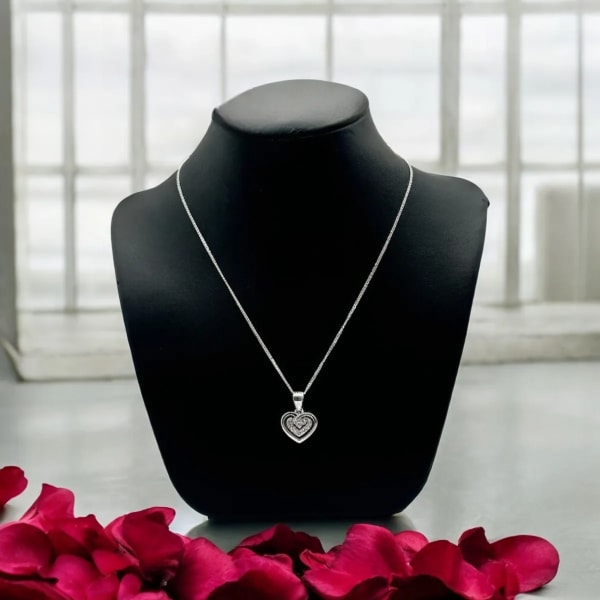 Small heart necklace worn