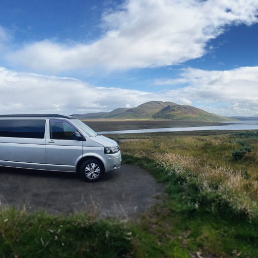 Selene the Camper parking in front a stunning vista in Scotland