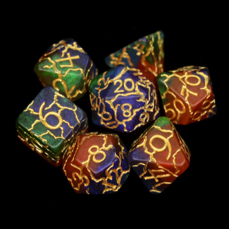 Green, red, blue, and gold polyhedral DND dice with crackle patterns displayed on a black background.