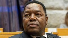 South Africa's police boss charged in connection with controversial health contract