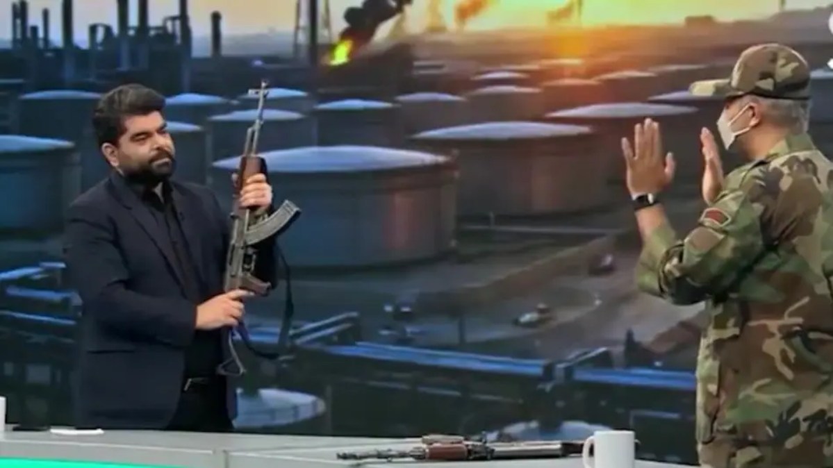 Iranian TV Anchor Fires Rifle During Controversial Live Broadcast