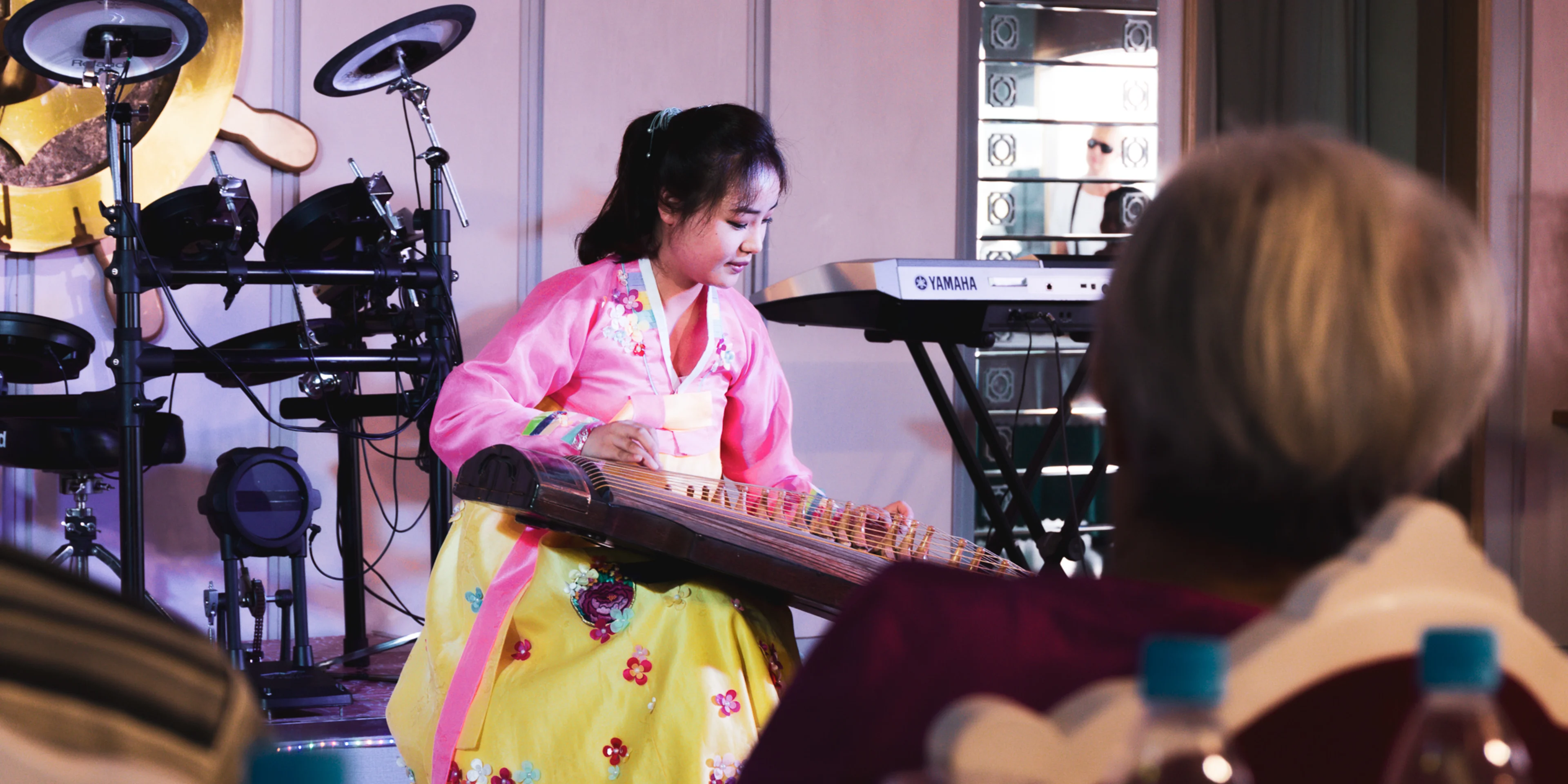 Photo of a North Korean person playing an instrument