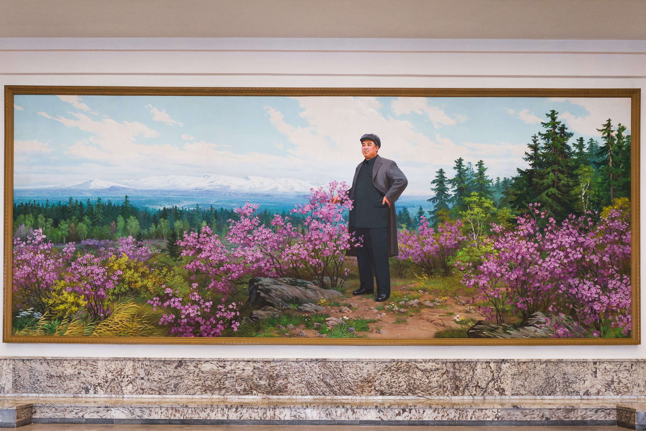 It's not grand unless we were greeted with another classic Kim Il-sung portrait at the entrance.