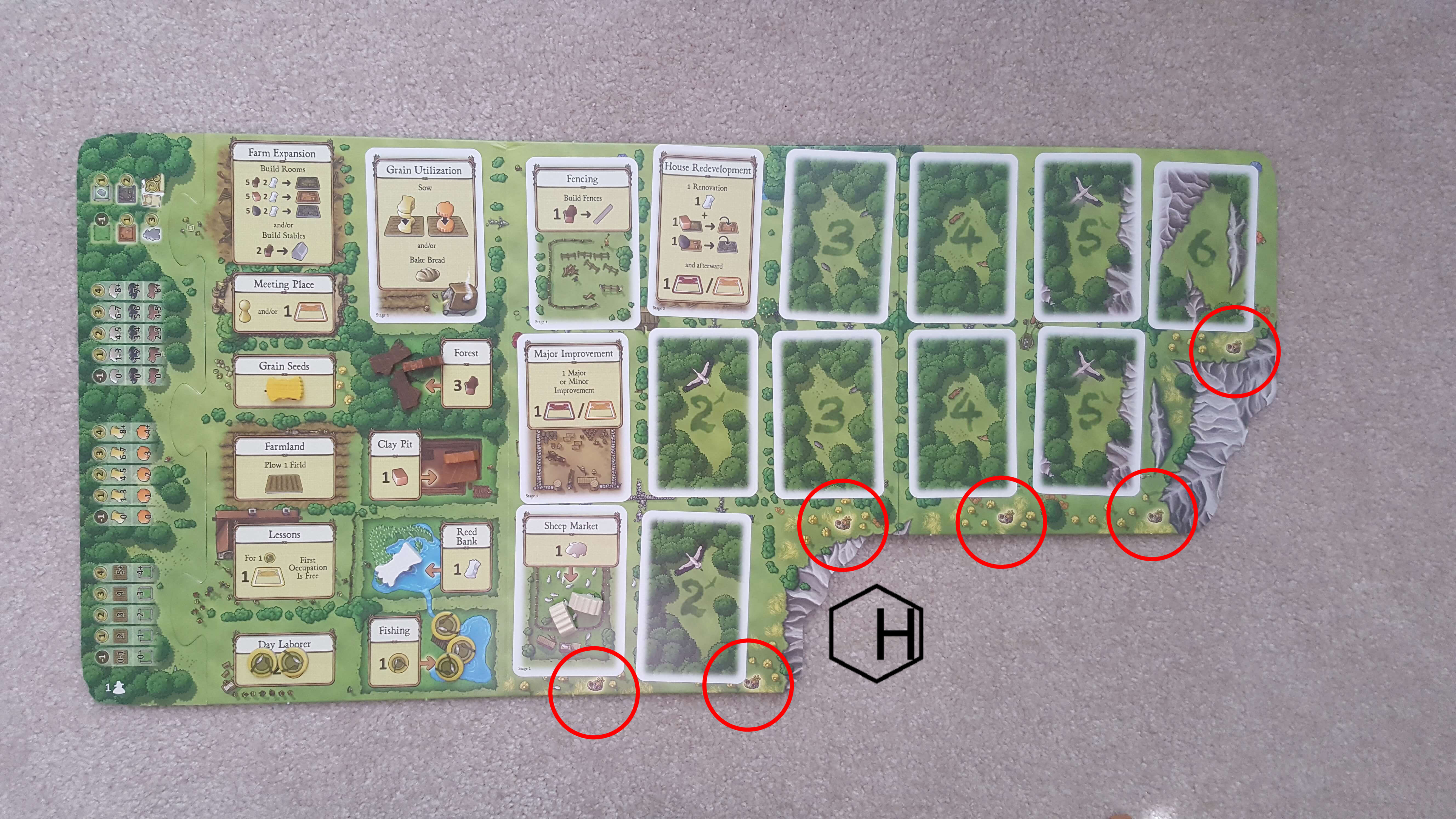 An Agricola game board mid-harvest
