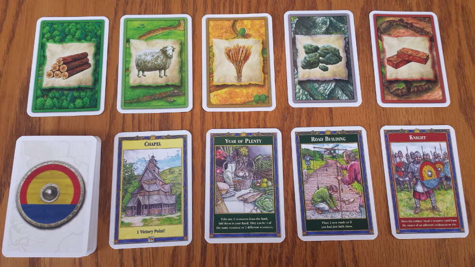 Catan resource and development cards Catan resource and development cards held by a player