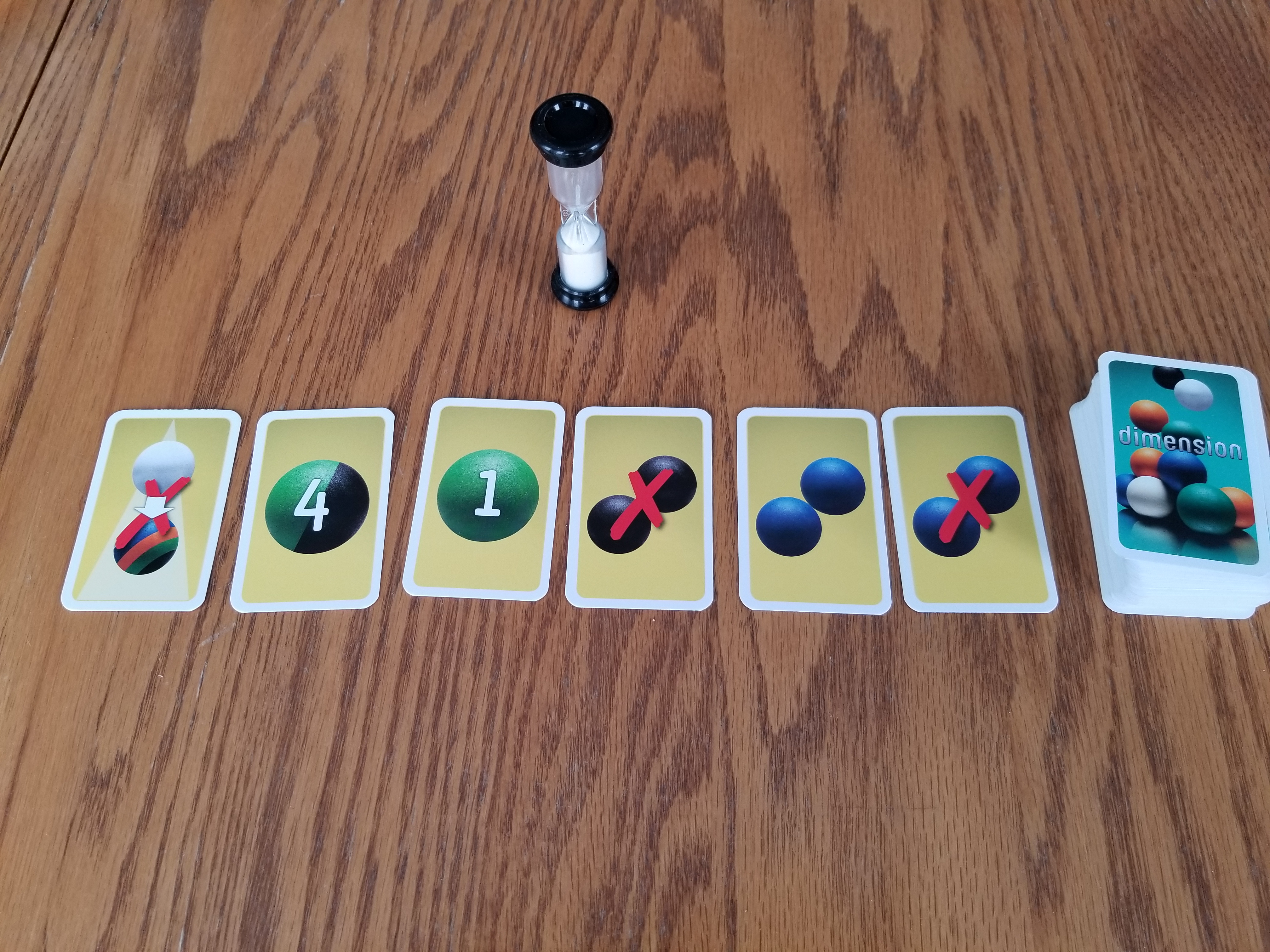 Dimension rule cards and timer Dimension rule cards laid out with the timer