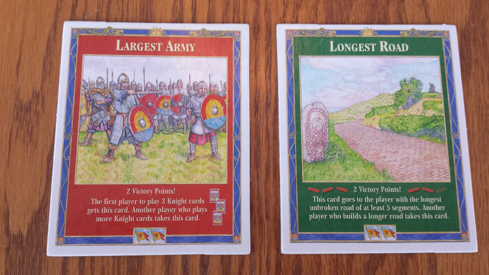 The Longest Road and Largest Army bonus cards, each worth 2 victory points