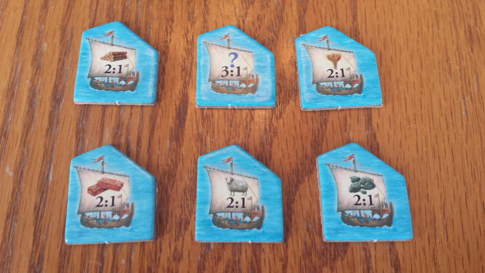 Catan harbour trading tiles showing 2:1 and 3:1 bank trade rates