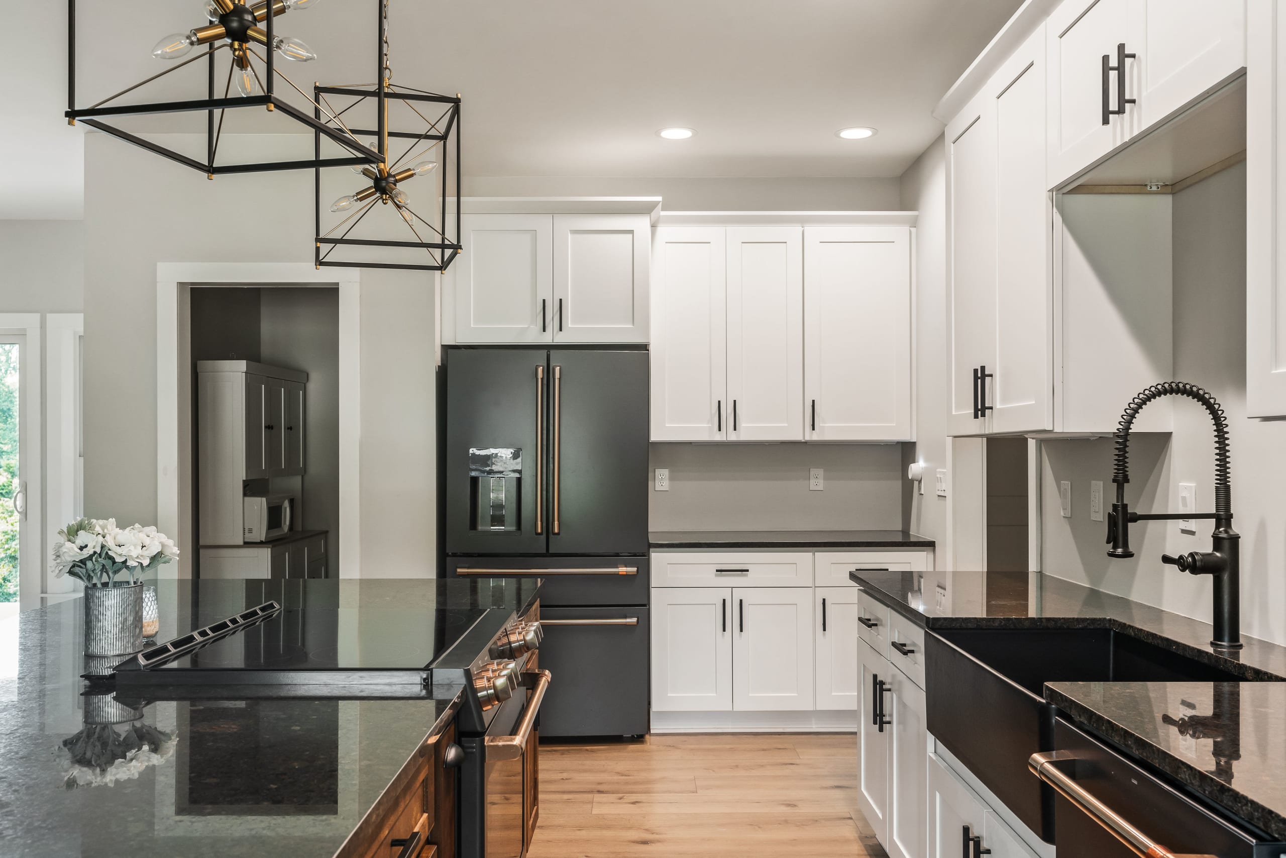 Kitchen with custom cabinetry and deep base sink designed for busy family cooking.