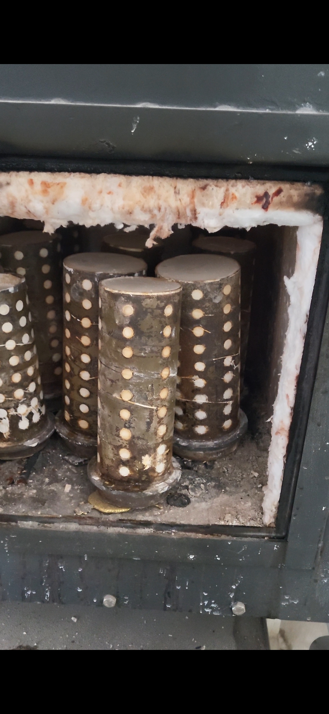 Molten gold casting under vacuum pressure inside a flask