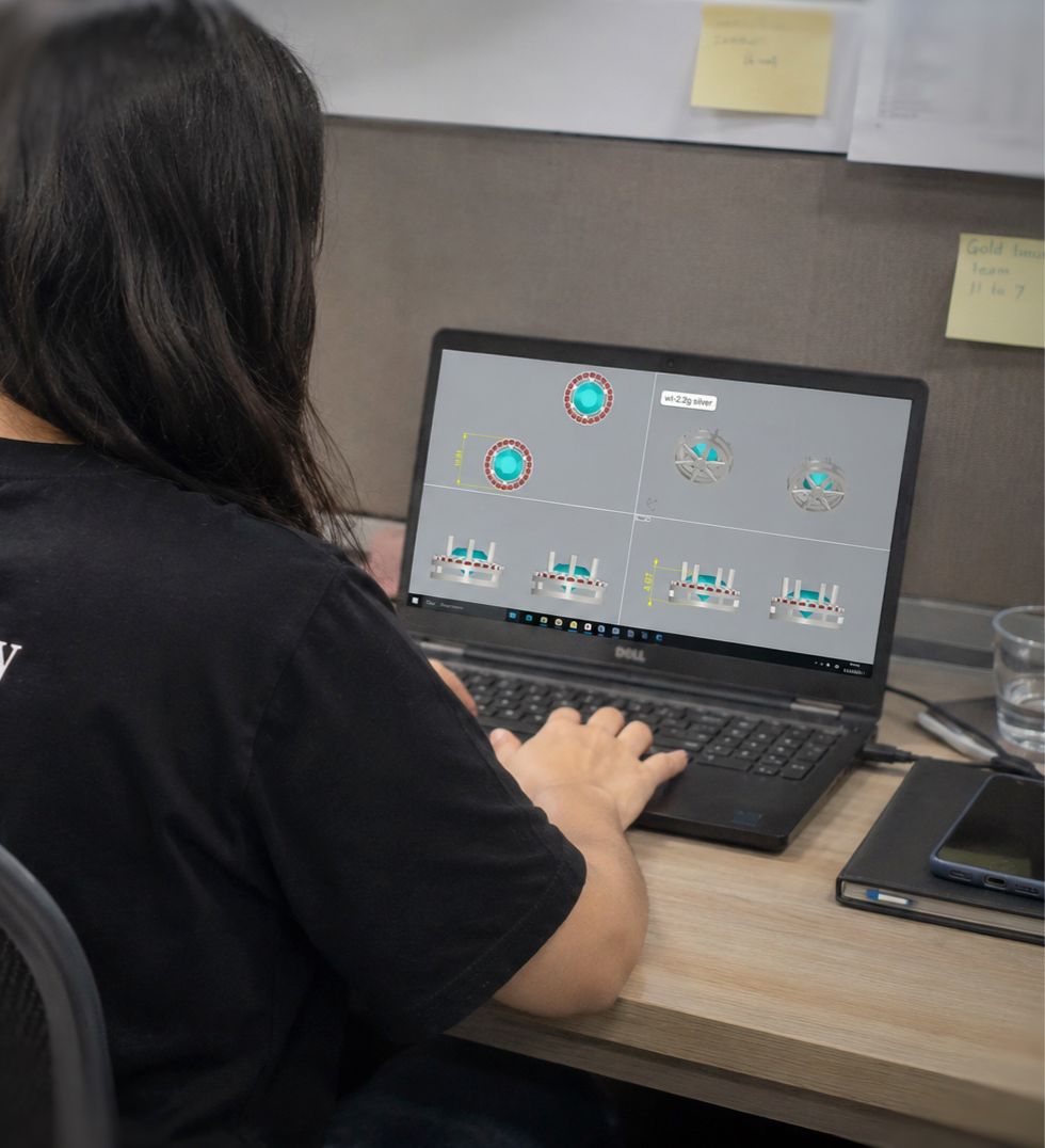 3D CAD design interface rendering a jewelry model on a workstation
