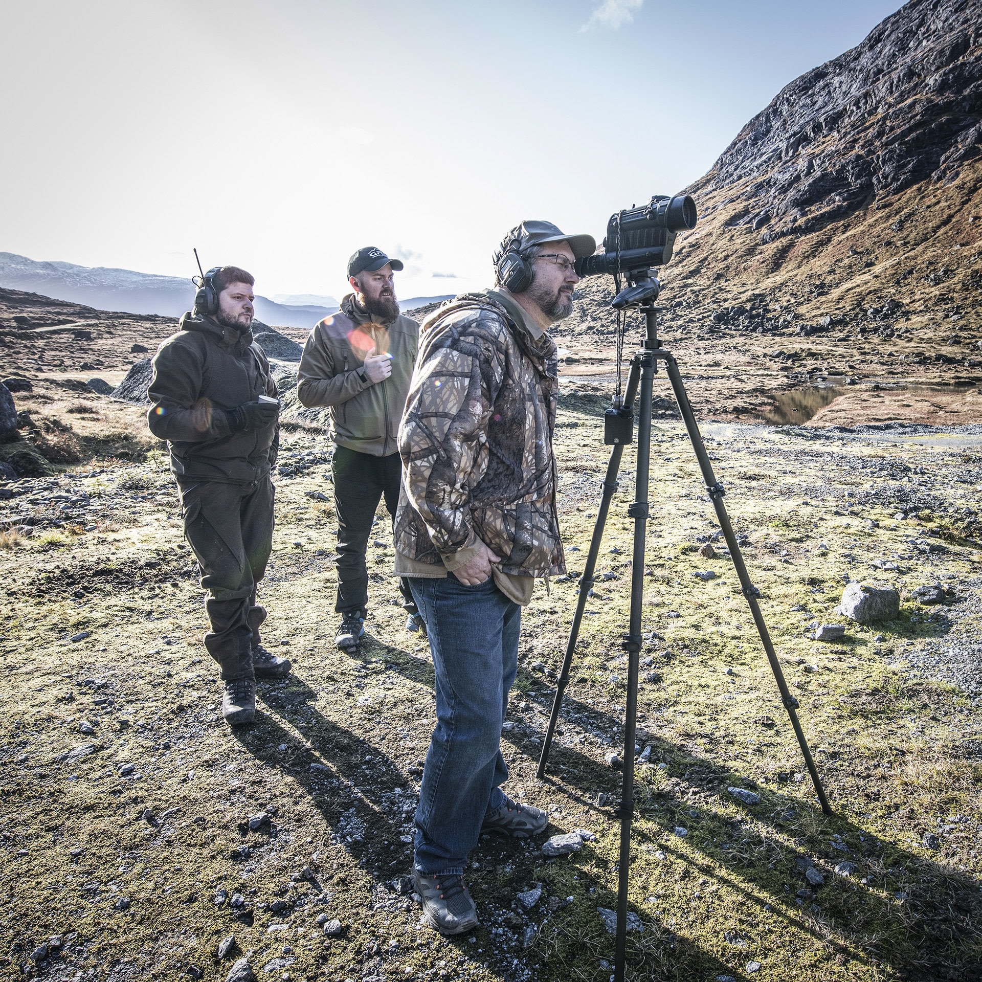 Photo of GRS Oscar, Eivind, Jerry, measuring distances on range Photo of GRS Oscar, Eivind, Jerry, measuring distances on range