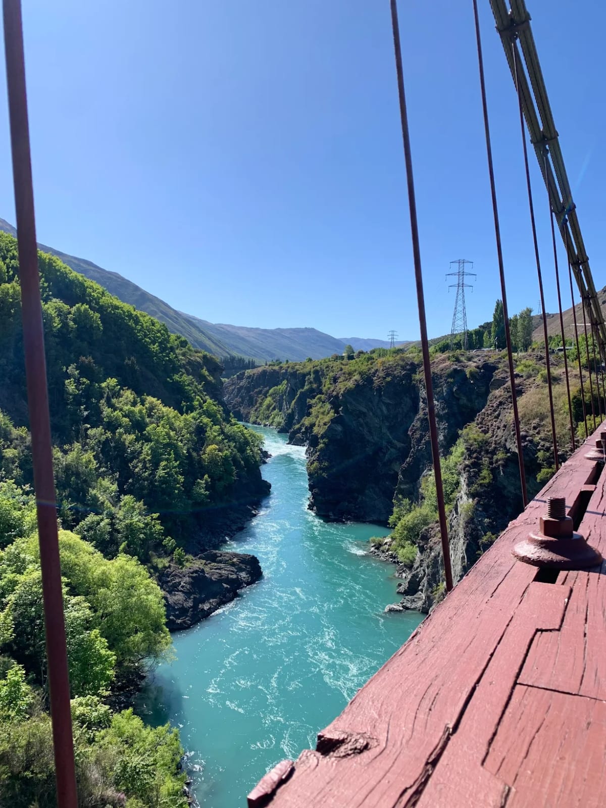View of the turquoise Kawarau river from a customer's bridge crossing