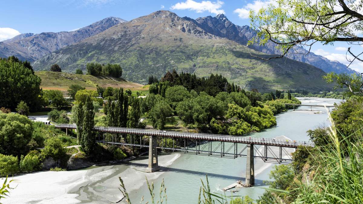 Bridge over the Shotover River with mountains