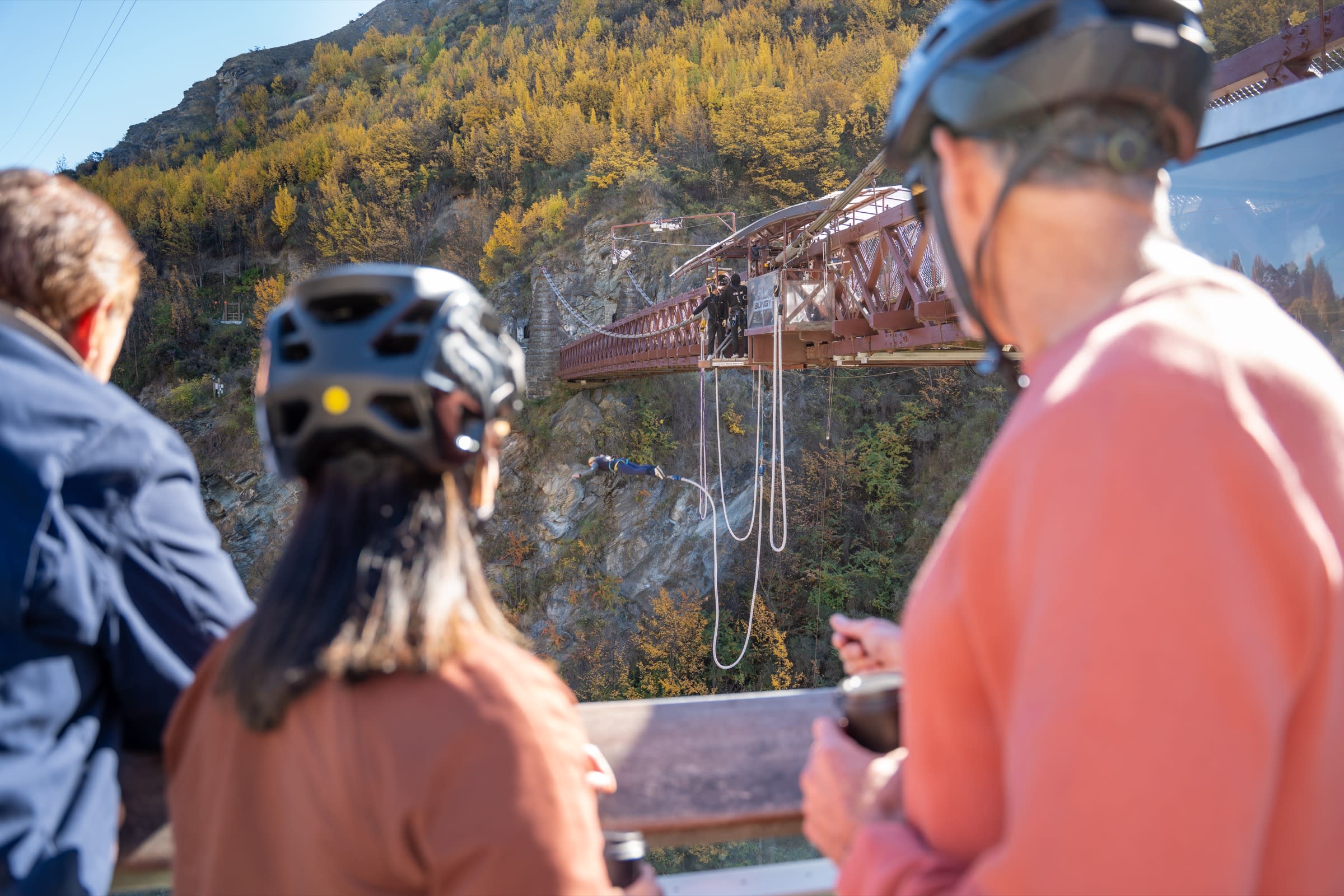 E-bike rider crossing the historic Kawarau Bungy Bridge on the way into Gibbston wine country
