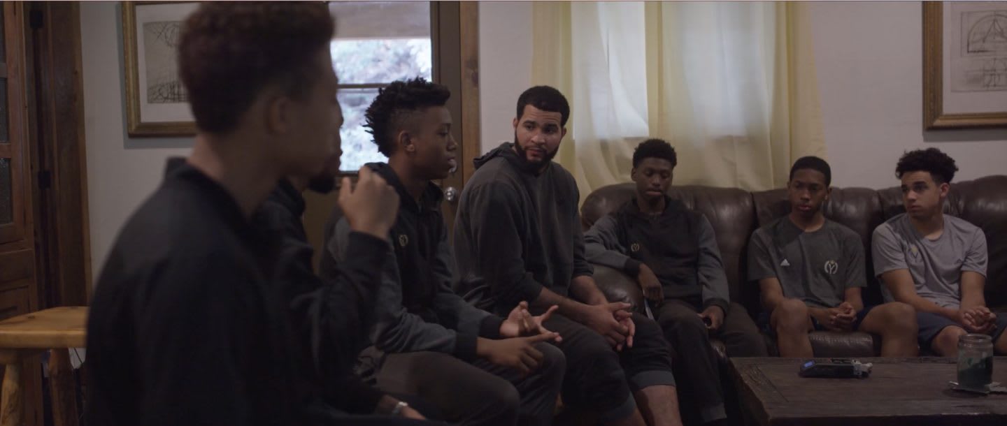 The Young Vets team sitting down talking and listening to each other. Teammates, community, friendship, listening.