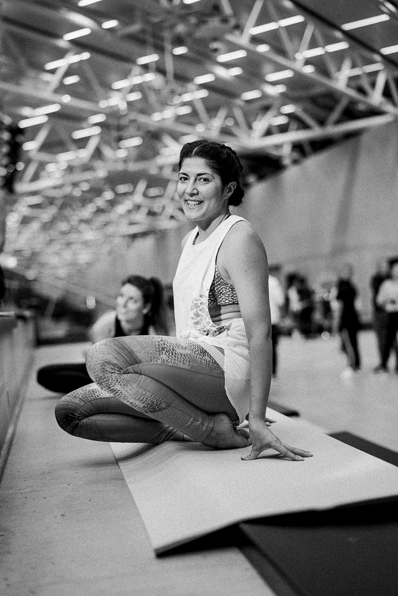 Female yogi sitting on her yoga mat smiling, adidas, employee, HereToCreate, GamePlan A, work, job, creativity, flow, self-improvement, leadership