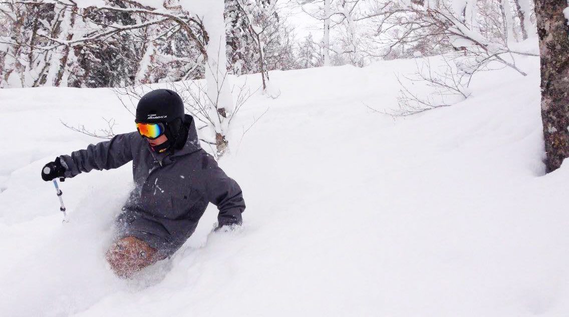 A man dives into the snow while skiing down a snowy slope. snow, winter, ski, skier, sport, skiing